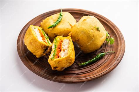 Premium Photo | Ulta Vada Pav is made with a spicy potato stuffed bun ...