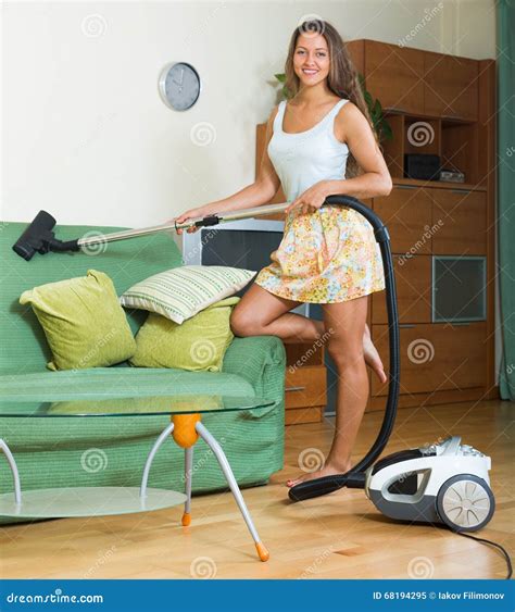 Female in Skirt Cleaning with Vacuum Cleaner Stock Image - Image of