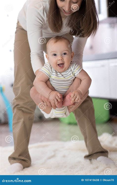 Young Mother Doing Yoga with Baby at Home Stock Photo - Image of ...