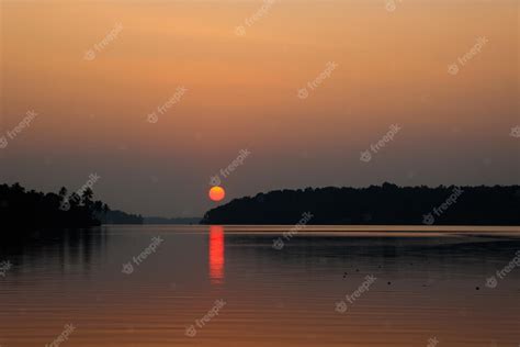 Free Photo | Dark sunset in ashtamudi lake kollam