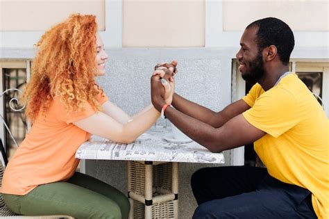 Free Photo | Side view of couple holding hands