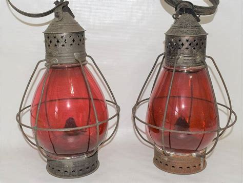 pair early fixed globe railroad lanterns  ruby globes