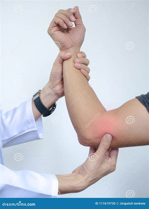 Orthopedic Surgeons In Teamwork In The Operating Room With Modern