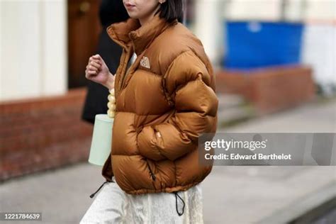 Brown Puffer Jacket Photos and Premium High Res Pictures - Getty Images