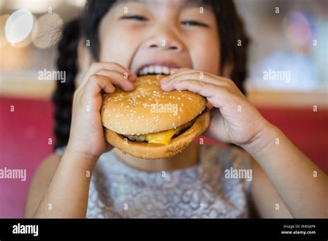 children eat chicken cheese hamburger food court stock photo alamy