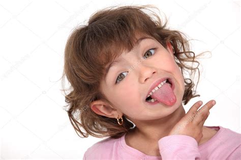 Little girl sticking tongue out ⬇ Stock Photo, Image by © photography33 #9767318