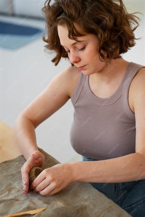 Free Photo | Braless woman working indoor
