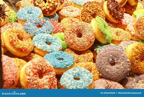 closeup  colorful assorted donuts ring shaped desserts sold