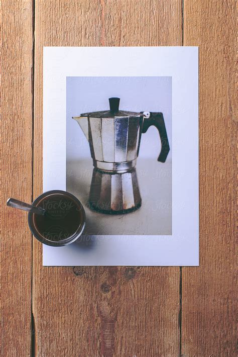 "Overhead Of A Kettle Photo With Coffee Cup On A Wooden Table." by