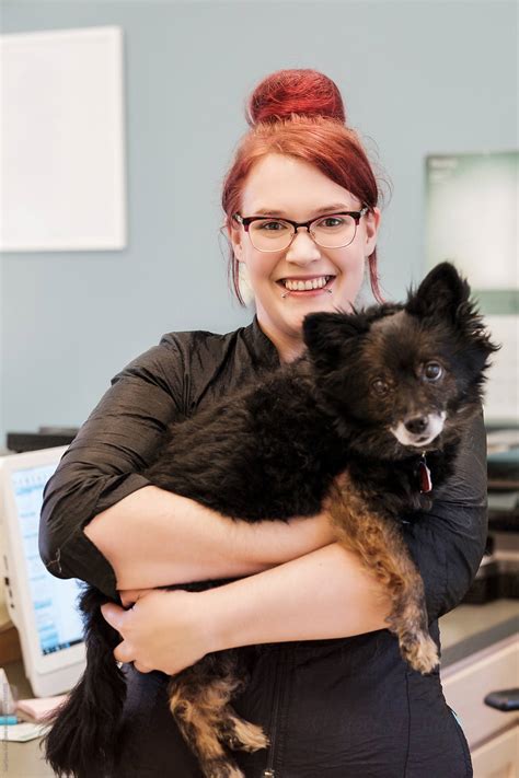 "Small Business Pet Groomer Owner Posing With A Dog" by Stocksy