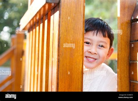 boy hiding  playground toys stock photo alamy