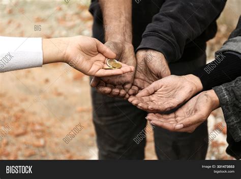 People Giving Money To The Poor 