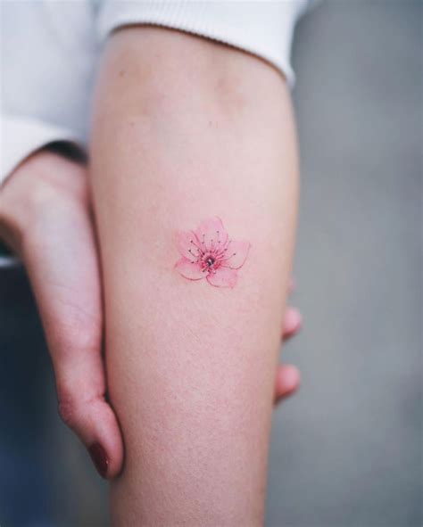 small minimalist cherry blossom tattoo forearm tattoo ideas