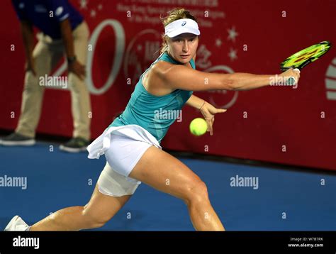Daria Gavrilova of Australia returns a shot to Anastasia Pavlyuchenkova ...