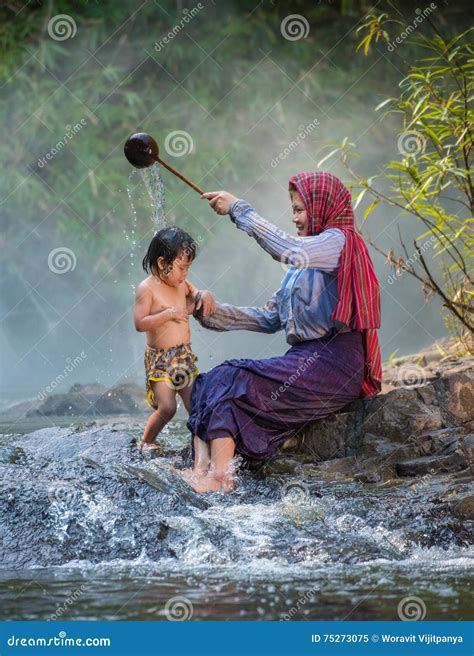 Mother Giving Daughter a Shower Stock Image - Image of skirt, riverside