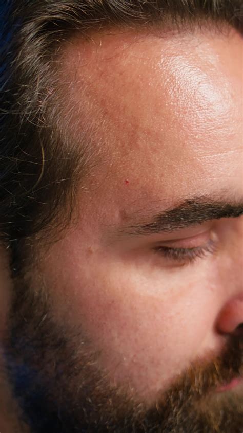 Vertical Portrait of content creator using high tech quality mic in