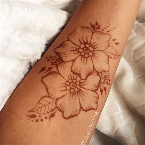 simple wrist flower henna tattoos