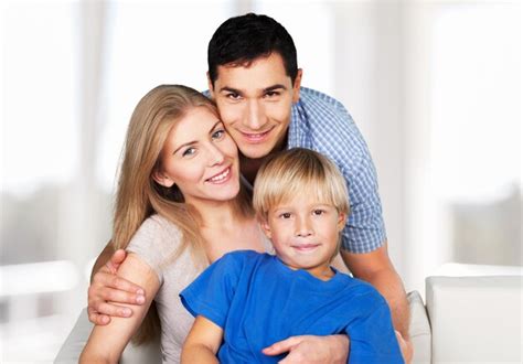 Premium Photo | Vertical portrait of a mixed cheerful family posing at ...