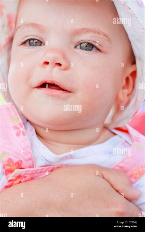 Smiling baby girl with blue eyes Stock Photo - Alamy