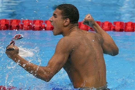 Tunisian teen wins surprise Olympic swimming gold | AP News