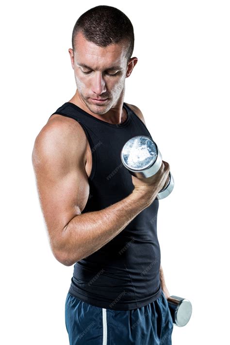 Premium Photo | Confident athlete working out with dumbbells