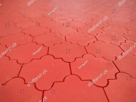 beautiful brick red interlock bricks layed in a good pattern, a close ...