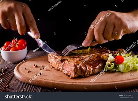 people eating steak table stock  images photography
