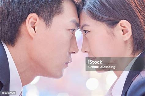 business people standing facetoface stock photo  image