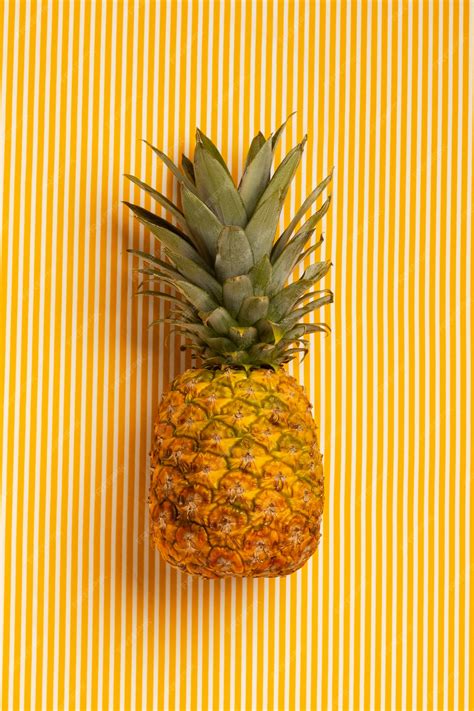 Free Photo | Still life of pineapple fruit with stem and leaves