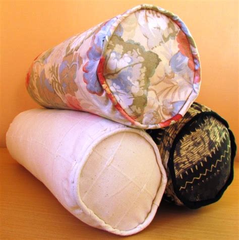 bolster pillows  elongated cushions  beds chairs  settees