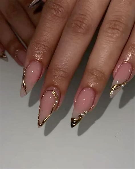 Gold chrome designs nail inspo. Nude base gold design stiletto nails. #