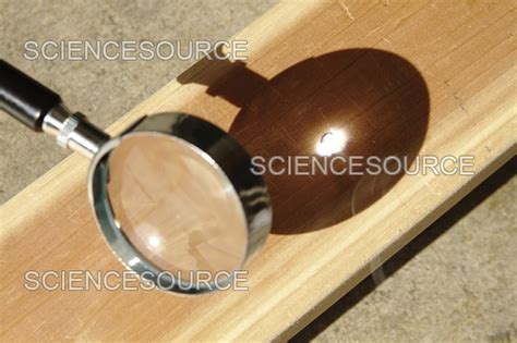 magnifying glass focusing sun light stock image science source images