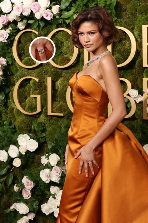 zendaya  bid   dressed  orange ball gown