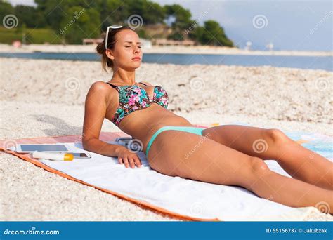 Pretty Girl Lying on the Beach and Sunbathing Stock Image - Image of ...