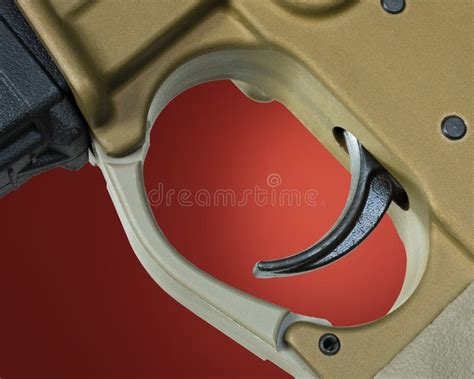 assault rifle trigger  red stock photo image  gray bronze