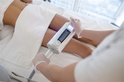 Premium Photo | Slimming method. doctors hands holding modern apparatus ...