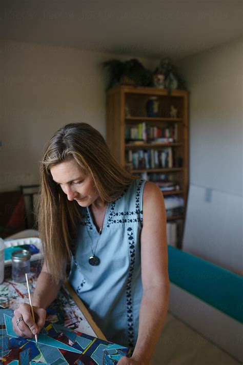 "Healthy, Artistic Mature Woman Relaxing In Art Studio" by Stocksy
