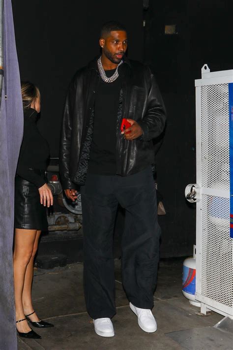 Tristan Thompson leaves party with model as Khloé debuts son