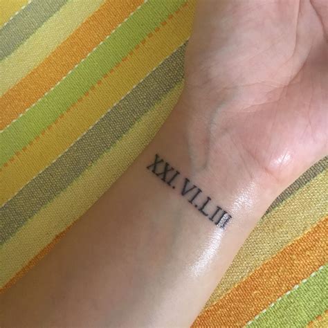 Roman Numerals Tattoo Wrist