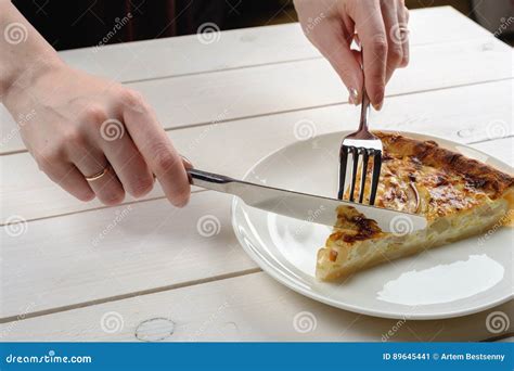 female hands cutting  piece  pie   white plate top view stock