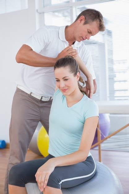 Premium Photo | Woman stretching her arm with trainer