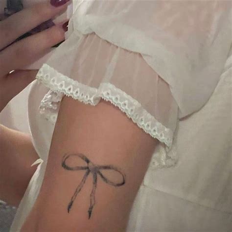 Bow ribbon tat on arm ! | Pretty tattoos, Dainty tattoos, Dope tattoos