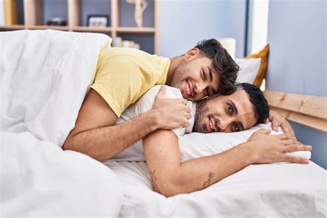 Men Hugging In Bed