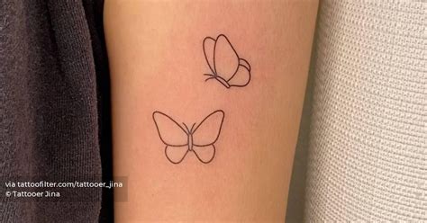 minimalist butterflies tattoo   bicep