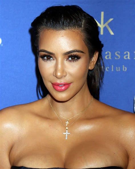 Kim Kardashian Decorates Cleavage With Layered Cross Necklaces