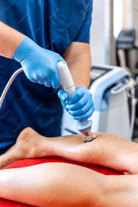 Premium Photo | Physical therapy of the shin with shock wave
