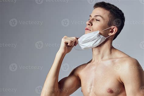 sport man nude torso medical mask gymnasium lifestyle isolated