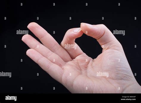 hand gesturing sign   agree  black background stock photo alamy