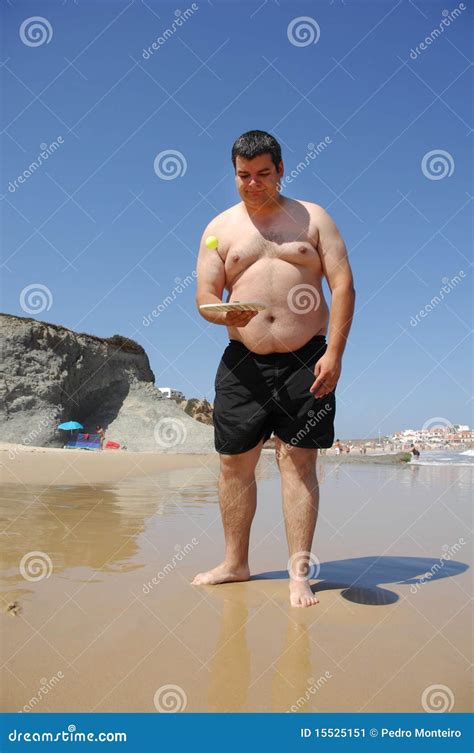 Fat Man Playing Beach Tennis on the Beach Stock Image - Image of jump ...