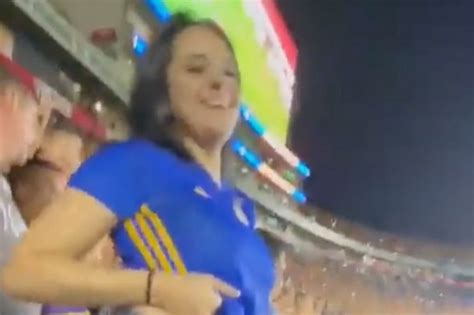 Fan flashes boobs in 'wildest celebration ever' and poses for selfies while topless with fellow